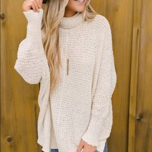 Loose ivory turtleneck sweater